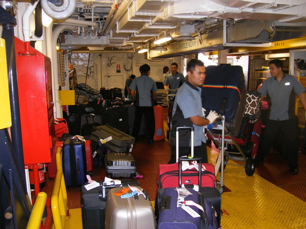 Luggage being gathered as it come into the ship by conveyor belt