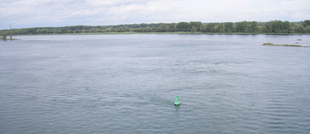 The strong current swirling around a buoy in the river