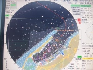 All the white dotson the radar screen  are AIS indicators from boats involved in the off-shore industry