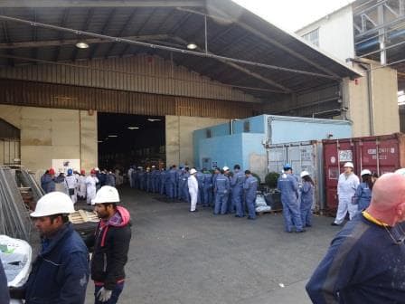 a long queue entering the HAL ware house to comply with the labor law of daily logging the working hours.